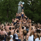 Illustration for article titled Gallery: Greasy Naval Cadets Try To Climb A Lard-Covered Monument